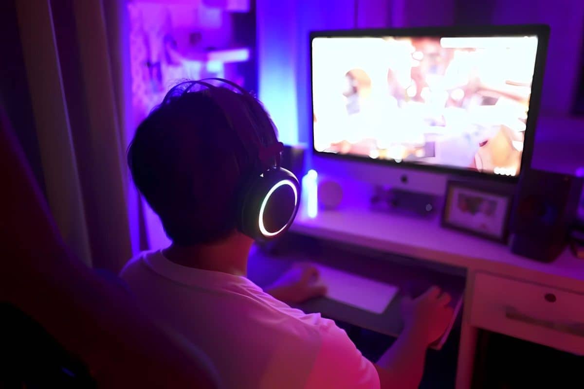 a gamer playing a language learning game on PC